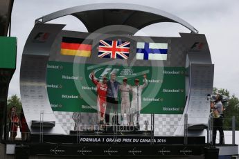 World © Octane Photographic Ltd. Mercedes AMG Petronas – Lewis Hamilton (1st), Scuderia Ferrari – Sebastian Vettel (2nd) and Williams Martini Racing, – Valtteri Bottas (3rd) with Evan Short (Constructors’ Trophy). Sunday 12th June 2016, F1 Canadian GP Podium, Circuit Gilles Villeneuve, Montreal, Canada. Digital Ref :1593LB1D4833