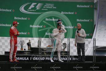 World © Octane Photographic Ltd. Mercedes AMG Petronas – Lewis Hamilton (1st), Scuderia Ferrari – Sebastian Vettel (2nd) and Williams Martini Racing, – Valtteri Bottas (3rd) with Michael Douglas. Sunday 12th June 2016, F1 Canadian GP Podium, Circuit Gilles Villeneuve, Montreal, Canada. Digital Ref :1593LB1D4892