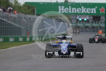 World © Octane Photographic Ltd. Sauber F1 Team C35 – Marcus Ericsson and McLaren Honda MP4-31 – Jenson Button. Saturday 11th June 2016, F1 Canadian GP Qualifying, Circuit Gilles Villeneuve, Montreal, Canada. Digital Ref :1589LB1D1514