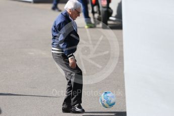 World © Octane Photographic Ltd. Bernie Ecclestone playing with Nico's Rosberg's football. Friday 29th July 2016, F1 German GP Practice 1, Hockenheim, Germany. Digital Ref : 1659CB5D9079