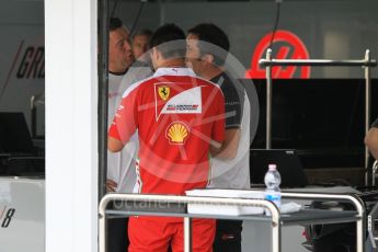 World © Octane Photographic Ltd. Haas F1 Team VF-16 garage with Ferrari engine technician. Thursday 28th July 2016, F1 German GP Set up, Hockenheim, Germany. Digital Ref :1658CB1D0218