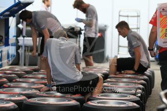 World © Octane Photographic Ltd. Manor Racing mechanics with Pirelli Supersoft (Red) tyres. Thursday 28th July 2016, F1 German GP Set up, Hockenheim, Germany. Digital Ref :1658CB1D0541