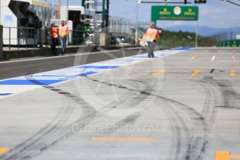 World © Octane Photographic Ltd. Tyre marks leaving a pit box. Friday 22nd July 2016, F1 Hungarian GP Practice 1, Hungaroring, Hungary. Digital Ref :