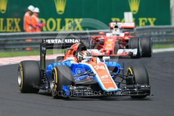 World © Octane Photographic Ltd. Manor Racing MRT05 - Pascal Wehrlein and Scuderia Ferrari SF16-H – Sebastian Vettel. Saturday 23rd July 2016, F1 Hungarian GP Practice 3, Hungaroring, Hungary. Digital Ref :1647CB1D7592