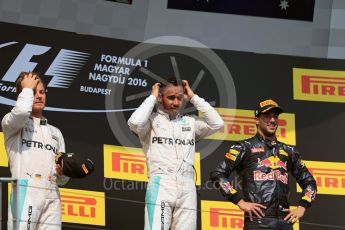World © Octane Photographic Ltd. Mercedes AMG Petronas W07 Hybrid – Lewis Hamilton and Nico Rosberg and Red Bull Racing RB12 – Daniel Ricciardo. Sunday 24th July 2016, F1 Hungarian GP Podium, Hungaroring, Hungary. Digital Ref :