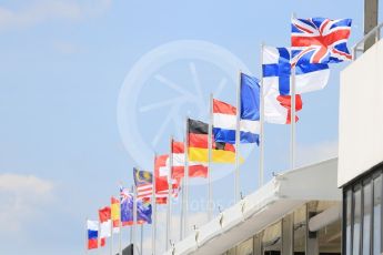 World © Octane Photographic Ltd. International flags flying above the pitlane. Thursday 21st July 2016, F1 Hungarian GP Paddock, Hungaroring, Hungary. Digital Ref :1636CB5D6432