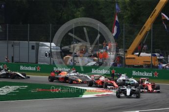 World © Octane Photographic Ltd. The Mercedes AMG Petronas W07 Hybrid of Nico Rosberg leads the 2 Ferraris of Vettel and Raikkonen and the Williams of Bottas through the 1st corner on the opening lap. Sunday 4th September 2016, F1 Italian GP Race, Monza, Italy. Digital Ref :1710LB2D6835