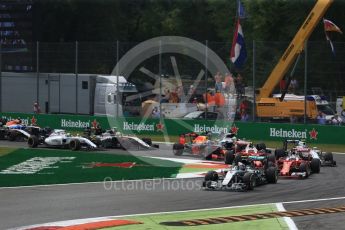World © Octane Photographic Ltd. The Mercedes AMG Petronas W07 Hybrid of Nico Rosberg leads the 2 Ferraris of Vettel and Raikkonen and the Williams of Bottas through the 1st corner on the opening lap. Sunday 4th September 2016, F1 Italian GP Race, Monza, Italy. Digital Ref :1710LB2D6839