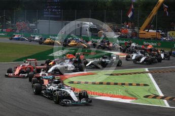 World © Octane Photographic Ltd. The Mercedes AMG Petronas W07 Hybrid of Nico Rosberg leads the 2 Ferraris of Vettel and Raikkonen and the Williams of Bottas through the 2nd chicane apex of the opening lap. Sunday 4th September 2016, F1 Italian GP Race, Monza, Italy. Digital Ref :1710LB2D6856