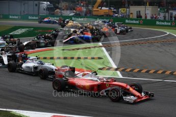 World © Octane Photographic Ltd. Scuderia Ferrari SF16-H – Kimi Raikkonen and Williams Martini Racing, Williams Mercedes FW38 – Valtteri Bottas on the opening lap. Sunday 4th September 2016, F1 Italian GP Race, Monza, Italy. Digital Ref :1710LB2D6861