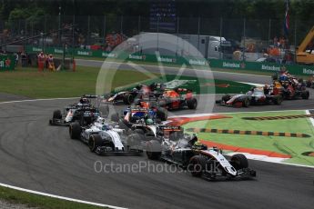 World © Octane Photographic Ltd. Sahara Force India VJM09 - Sergio Perez and Nico Hulkenberg racing with Williams Martini Racing, Williams Mercedes FW38 – Felipe Massa on the opening lap. Sunday 4th September 2016, F1 Italian GP Race, Monza, Italy. Digital Ref :1710LB2D6865