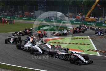World © Octane Photographic Ltd. Sahara Force India VJM09 - Sergio Perez and Nico Hulkenberg racing with Williams Martini Racing, Williams Mercedes FW38 – Felipe Massa on the opening lap. Sunday 4th September 2016, F1 Italian GP Race, Monza, Italy. Digital Ref :1710LB2D6867