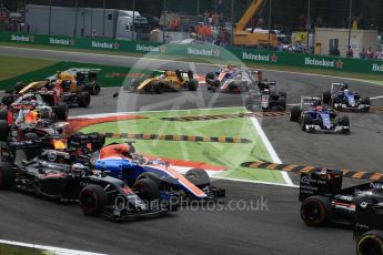 World © Octane Photographic Ltd. McLaren Honda MP4-31 of Fernando Alonso and the Manor Racing MRT05 of Pascal Wehrlein race on the opening lap as the Saubers of Ericsson and Nasr and the McLaren of Button cut the chicane. Sunday 4th September 2016, F1 Italian GP Race, Monza, Italy. Digital Ref :1710LB2D6871