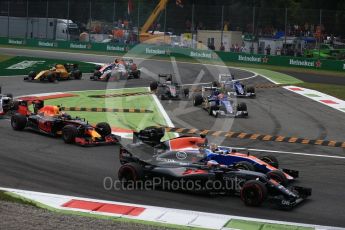 World © Octane Photographic Ltd. McLaren Honda MP4-31 of Fernando Alonso and the Manor Racing MRT05 of Pascal Wehrlein race on the opening lap as the Saubers of Ericsson and Nasr and the McLaren of Button cut the chicane. Sunday 4th September 2016, F1 Italian GP Race, Monza, Italy. Digital Ref :1710LB2D6875