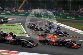 World © Octane Photographic Ltd. The Red Bull Racing RB12 of Max Verstappen and the Scuderia Toro Rosso STR11 of Carlos Sainz on teh opening lap as the Saubers of Ericsson and Nasr and the McLaren of Button cut the chicane. Sunday 4th September 2016, F1 Italian GP Race, Monza, Italy. Digital Ref :1710LB2D6881