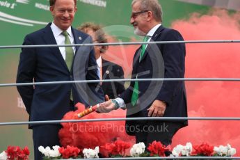 World © Octane Photographic Ltd. Examining the flare that was thrown onto the podium. Sunday 4th September 2016, F1 Italian GP Podium, Monza, Italy. Digital Ref :1711LB1D0743