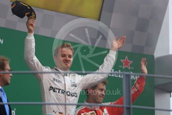 World © Octane Photographic Ltd. Mercedes AMG Petronas – Nico Rosberg (1st) and Scuderia Ferrari – Sebastian Vettel (3rd). Sunday 4th September 2016, F1 Italian GP Podium, Monza, Italy. Digital Ref :1711LB1D0921