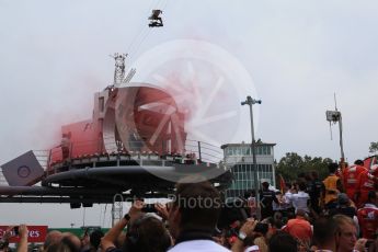 World © Octane Photographic Ltd. Red Flare thrown onto podium before the ceremony. Sunday 4th September 2016, F1 Italian GP Parc Ferme, Monza, Italy. Digital Ref :1711LB2D7570