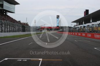 World © Octane Photographic Ltd. Empty starting grid and the run to turn 1. Sunday 9th October 2016, F1 Japanese GP, Suzuka Circuit, Suzuka, Japan. Digital Ref :1735LB1D6946