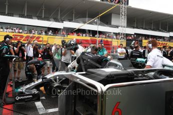 World © Octane Photographic Ltd. Mercedes AMG Petronas W07 Hybrid – Nico Rosberg. Sunday 9th October 2016, F1 Japanese GP - Grid. Suzuka Circuit, Suzuka, Japan. Digital Ref :1735LB1D7339