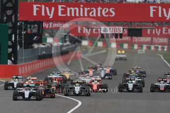 World © Octane Photographic Ltd. Mercedes AMG Petronas W07 Hybrid – Nico Rosberg leads the pack off the line as Lewis Hamilton makes a poor start and drops down the order. Sunday 9th October 2016, F1 Japanese GP - Race. Suzuka Circuit, Suzuka, Japan. Digital Ref :