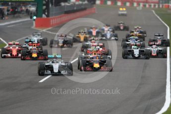 World © Octane Photographic Ltd. Mercedes AMG Petronas W07 Hybrid – Nico Rosberg leads the pack off the line as Lewis Hamilton makes a poor start and drops down the order. Sunday 9th October 2016, F1 Japanese GP - Race. Suzuka Circuit, Suzuka, Japan. Digital Ref :