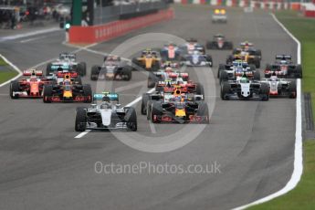 World © Octane Photographic Ltd. Mercedes AMG Petronas W07 Hybrid – Nico Rosberg leads the pack off the line as Lewis Hamilton makes a poor start and drops down the order. Sunday 9th October 2016, F1 Japanese GP - Race. Suzuka Circuit, Suzuka, Japan. Digital Ref :
