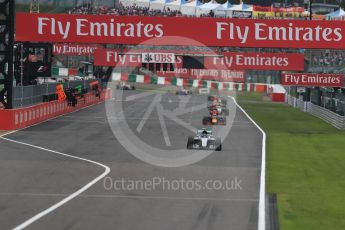 World © Octane Photographic Ltd. Lap 2 - Mercedes AMG Petronas W07 Hybrid – Nico Rosberg leads the Red Bull Racing RB12 of Max Verstappen and the Sahara Force India VJM09 of Sergio Perez. Sunday 9th October 2016, F1 Japanese GP - Race. Suzuka Circuit, Suzuka, Japan. Digital Ref :