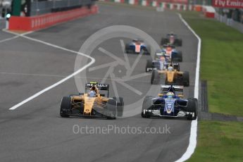 World © Octane Photographic Ltd. Renault Sport F1 Team RS16 – Jolyon Palmer and Sauber F1 Team C35 – Marcus Ericsson. Sunday 9th October 2016, F1 Japanese GP - Race, Suzuka Circuit, Suzuka, Japan. Digital Ref :