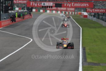 World © Octane Photographic Ltd. Red Bull Racing RB12 – Max Verstappen and Scuderia Ferrari SF16-H – Sebastian Vettel. Sunday 9th October 2016, F1 Japanese GP - Race, Suzuka Circuit, Suzuka, Japan. Digital Ref :