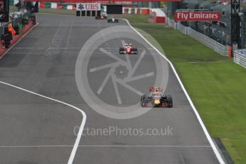 World © Octane Photographic Ltd. Red Bull Racing RB12 of Max Verstappen and the Scuderia Ferrari SF16-H of Sebastian Vettel. Sunday 9th October 2016, F1 Japanese GP - Race. Suzuka Circuit, Suzuka, Japan. Digital Ref :