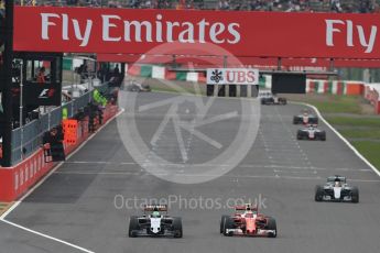 World © Octane Photographic Ltd. Sahara Force India VJM09 of Nico Hulkenberg and the Scuderia Ferrari SF16-H of Kimi Raikkonen with the Mercedes AMG Petronas W07 Hybrid of Lewis Hamilton gaining ground. Sunday 9th October 2016, F1 Japanese GP - Race, Suzuka Circuit, Suzuka, Japan. Digital Ref :