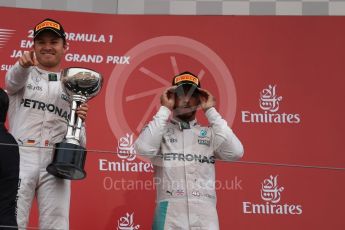World © Octane Photographic Ltd. Mercedes AMG Petronas – Nico Rosberg (1st) and Lewis Hamilton (3rd). Sunday 9th October 2016, F1 Japanese GP - Podium. Suzuka Circuit, Suzuka, Japan. Digital Ref :1737LB1D8489