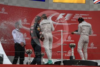 World © Octane Photographic Ltd. Mercedes AMG Petronas – Nico Rosberg (1st), Red Bull Racing – Max Verstappen (2nd) and Mercedes AMG Petronas – Lewis Hamilton (3rd). Sunday 9th October 2016, F1 Japanese GP - Podium. Suzuka Circuit, Suzuka, Japan. Digital Ref :1737LB1D8608