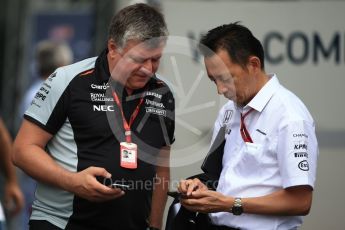 World © Octane Photographic Ltd. McLaren Honda - Yusuke Hasegawa and Otmar Szafnauer. Saturday 8th October 2016, F1 Japanese GP - Paddock, Suzuka Circuit, Suzuka, Japan. Digital Ref : 1731LB2D2625