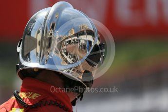 World © Octane Photographic Ltd. Reflection of pit lane in fire marshals helmet. Saturday 28th May 2016, F1 Monaco GP Practice 3, Monaco, Monte Carlo. Digital Ref : 1568LB1D9754