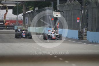 World © Octane Photographic Ltd. McLaren Honda MP4-31 – Jenson Button and Haas F1 Team VF-16 – Romain Grosjean. Saturday 17th September 2016, F1 Singapore GP Practice 3, Marina Bay Circuit, Singapore. Digital Ref : 1720CB1D6494