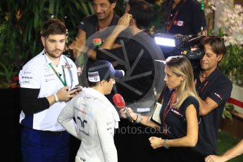 World © Octane Photographic Ltd. Williams Martini Racing, Williams Mercedes FW38 – Felipe Massa and junior press officer Aaron Rook. Saturday 17th September 2016, F1 Singapore GP Qualifying, Marina Bay Circuit, Singapore. Digital Ref :1721LB1D0813