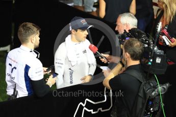 World © Octane Photographic Ltd. Williams Martini Racing, Williams Mercedes FW38 – Felipe Massa and junior press officer Aaron Rook. Saturday 17th September 2016, F1 Singapore GP Qualifying, Marina Bay Circuit, Singapore. Digital Ref :1721LB1D0824