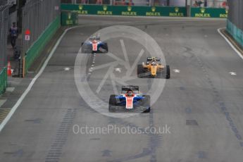 World © Octane Photographic Ltd. Manor Racing MRT05 - Pascal Wehrlein and Esteban Ocon split by Renault Sport F1 Team RS16 – Jolyon Palmer. Friday 16th September 2016, F1 Singapore GP Practice 1, Marina Bay Circuit, Singapore. Digital Ref :