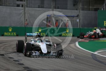 World © Octane Photographic Ltd. Mercedes AMG Petronas W07 Hybrid – Nico Rosberg and Haas F1 Team VF-16 - Esteban Gutierrez. Friday 16th September 2016, F1 Singapore GP Practice 1, Marina Bay Circuit, Singapore. Digital Ref :