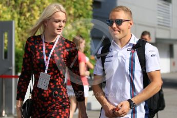 World © Octane Photographic Ltd. Williams Martini Racing – Valtteri Bottas and new wife Emilia Pikkarainen. Friday 16th September 2016, F1 Singapore GP Paddock, Marina Bay Circuit, Singapore. Digital Ref :1715CB1D5612