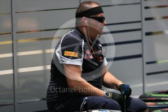 World © Octane Photographic Ltd. Scuderia Toro Rosso mechanic setting up Pirelli intermediate tyres. Thursday 15th September 2016, F1 Singapore GP Paddock, Marina Bay Circuit, Singapore. Digital Ref :1713CB5D3487