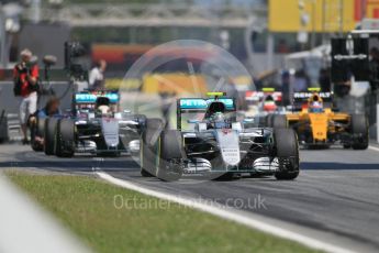 World © Octane Photographic Ltd. Mercedes AMG Petronas W07 Hybrid – Nico Rosberg and Lewis Hamilton exit the pits. Sunday 15th May 2016, F1 Spanish GP Race, Circuit de Barcelona Catalunya, Spain. Digital Ref :