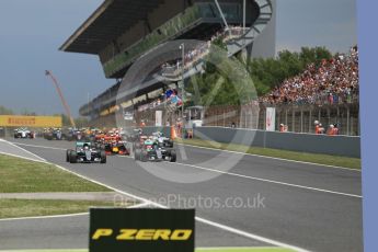 World © Octane Photographic Ltd. Mercedes AMG Petronas W07 Hybrid – Nico Rosberg and Lewis Hamilton lead the pack on the off the line. Sunday 15th May 2016, F1 Spanish GP Race, Circuit de Barcelona Catalunya, Spain. Digital Ref :