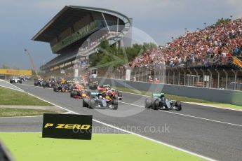 World © Octane Photographic Ltd. Mercedes AMG Petronas W07 Hybrid – Nico Rosberg and Lewis Hamilton lead the pack on the off the line. Sunday 15th May 2016, F1 Spanish GP Race, Circuit de Barcelona Catalunya, Spain. Digital Ref :