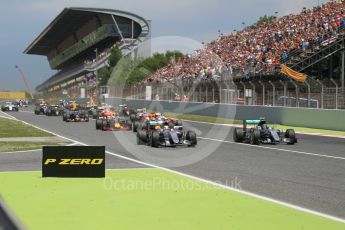 World © Octane Photographic Ltd. Mercedes AMG Petronas W07 Hybrid – Nico Rosberg and Lewis Hamilton lead the pack on the off the line. Sunday 15th May 2016, F1 Spanish GP Race, Circuit de Barcelona Catalunya, Spain. Digital Ref :