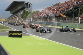 World © Octane Photographic Ltd. Mercedes AMG Petronas W07 Hybrid – Nico Rosberg and Lewis Hamilton lead the pack on the off the line. Sunday 15th May 2016, F1 Spanish GP Race, Circuit de Barcelona Catalunya, Spain. Digital Ref :