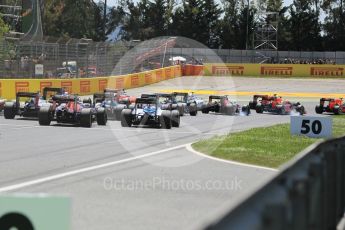 World © Octane Photographic Ltd. A Red Bull and Toro Rosso lock brakes into turn 1. Sunday 15th May 2016, F1 Spanish GP Race, Circuit de Barcelona Catalunya, Spain. Digital Ref :