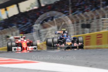 World © Octane Photographic Ltd. Scuderia Toro Rosso STR11 – Carlos Sainz and Scuderia Ferrari SF16-H – Kimi Raikkonen. Sunday 15th May 2016, F1 Spanish GP Race, Circuit de Barcelona Catalunya, Spain. Digital Ref :